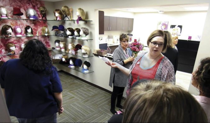 Lisa Beggs, breast navigator for the Breast Center gives a tour of the facility’s new location at 410 E. Spruce St. inside Heartland Cancer Center, in March 2017. The Breast Center was previously located at 309 E. Walnut St. [JOSCH HARBOUR/STAFF PHOTOGRAPHER]